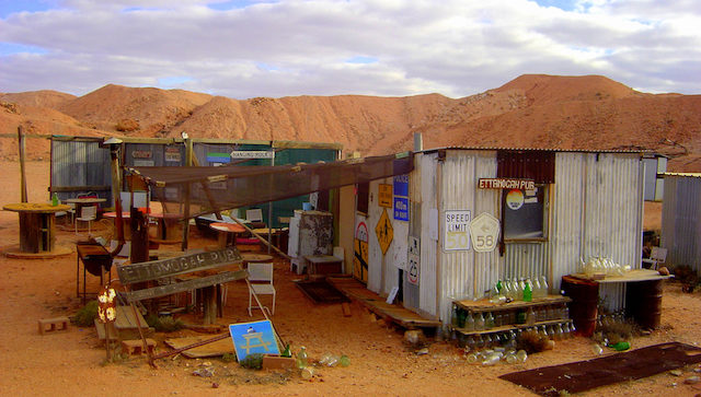 Happy hour Bill sold home-distilled ‘grog’ in his unlicensed pub, raising over $480,000 for Flying Doctors, (population approx. 10 people) / White Dam Limited edition 1/200 Size: Price: Price: 425 x 750 mm $375 image $650 frame included